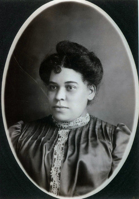 black and white portrait of an African American woman in a dress