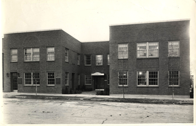 Photograph of The Professional Building main entrance from street view. The Professional Building housed most lawyers and doctors in Moscow, Idaho, along with the Robinson's Exclusive Prescription Pharmacy, grossing $8,000 a year in rent.