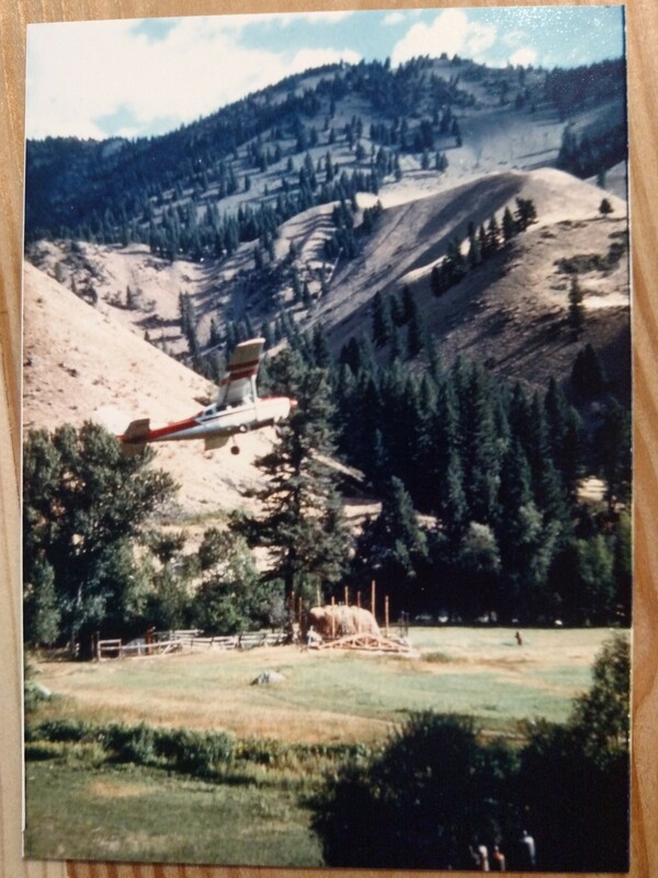 item thumbnail for View of a plane from Arnold Aviation flying over the hay barn, in construction at they Taylor Wilderness Research Station