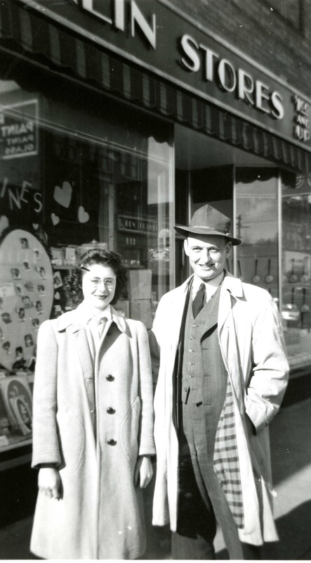 item thumbnail for A manager and employee in front of the Ben Franklin Store.