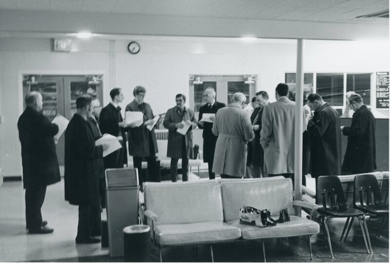 item thumbnail for Moscow airport interior with men listening to Boyd Martin