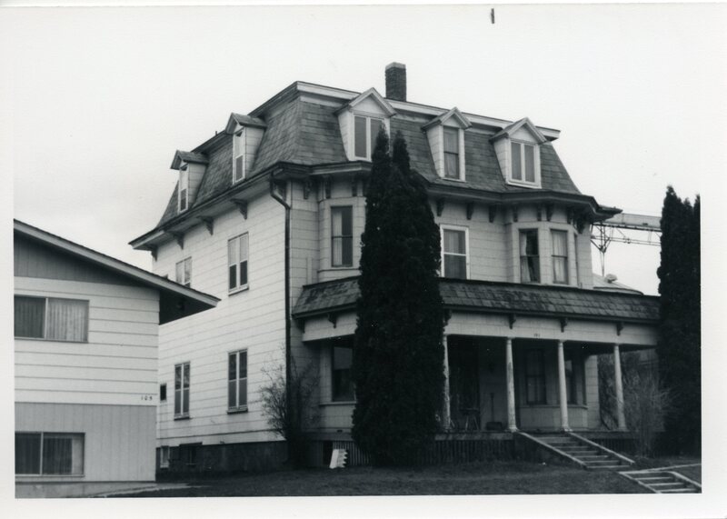 item thumbnail for Quesnell family in front of their home