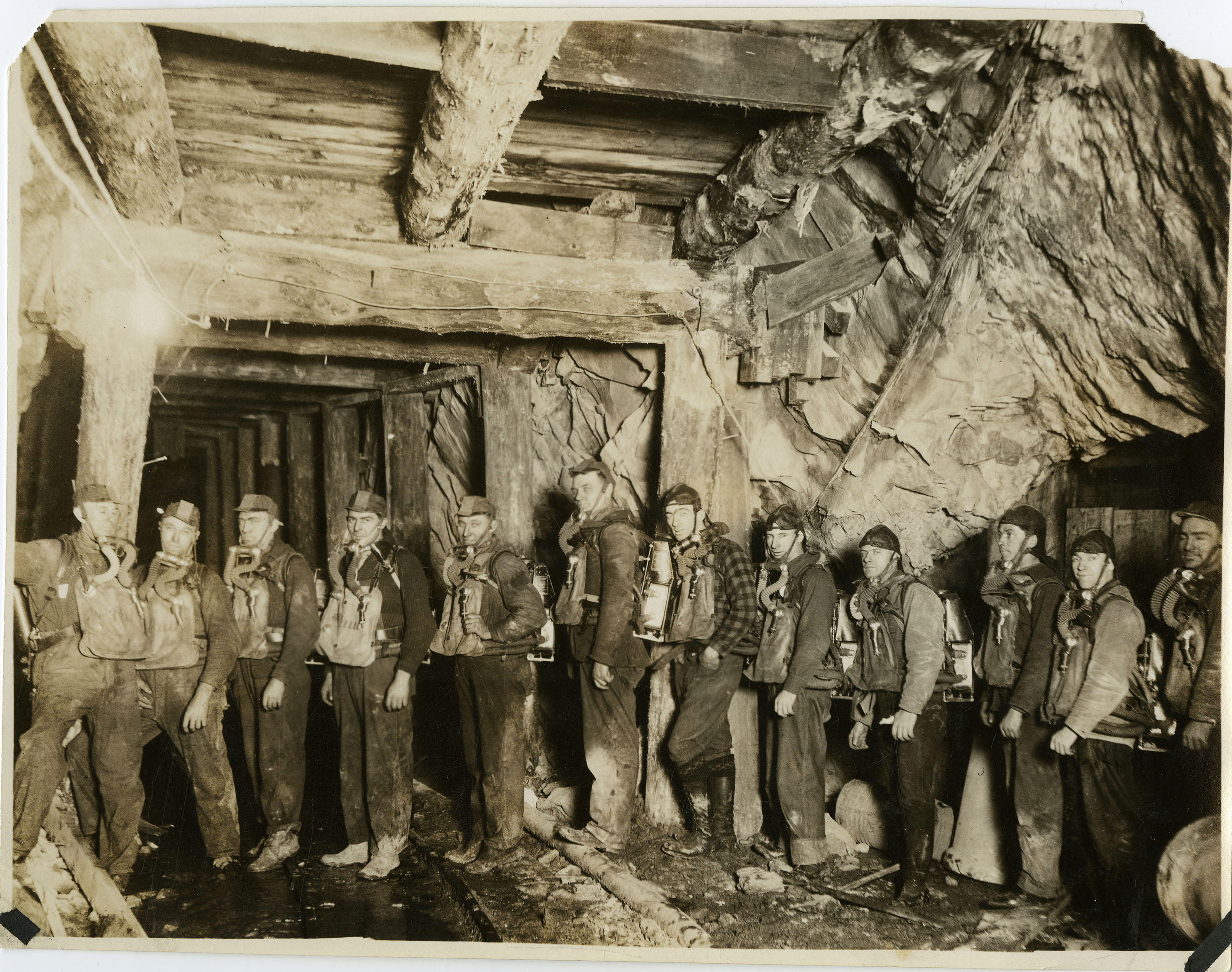 Miners with oxygen masks and tanks [01] | George W. Tabor Photographs